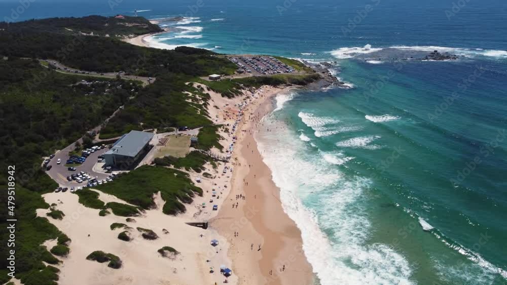 Drone aerial shot of Soldiers Beach Surf Club with Pacific Ocean reef