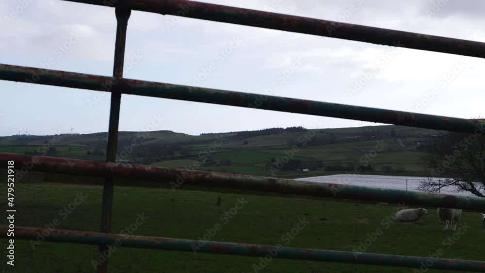View of Holmfirth countryside in England Yorkshire through view of gate View of Holmfirth countryside in England Yorkshire through view of gate