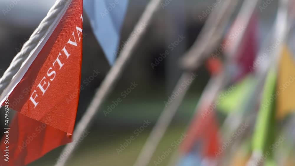 Bunting with 'Festival' written on it, blowing in the wind Bunting with 'Festival' written on it, blowing in the wind