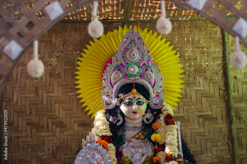 idol of hindu goddess saraswati being worshipped during saraswati puja festival in bengal. photo