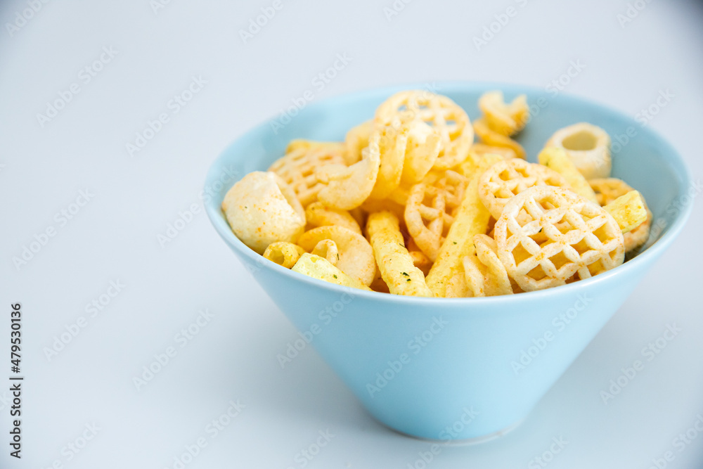 chips in a bowl. isolated on white chips in a bowl. isolated on white