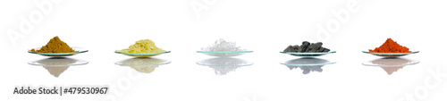 Chemical ingredient in chemical watch glass on white laboratory table. Organic Curcuma Powder, Sodium sulfide flakes, Sodium Thiosulfate, Aluminium powder and Lead(II,IV) oxide. Side View
