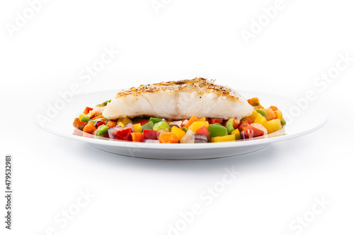 Grilled cod with vegetables in plate isolated on white background 