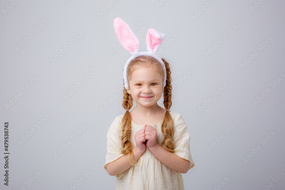 cute little girl with bunny ears on a white background, portrait cute little girl with bunny ears on a white background, portrait