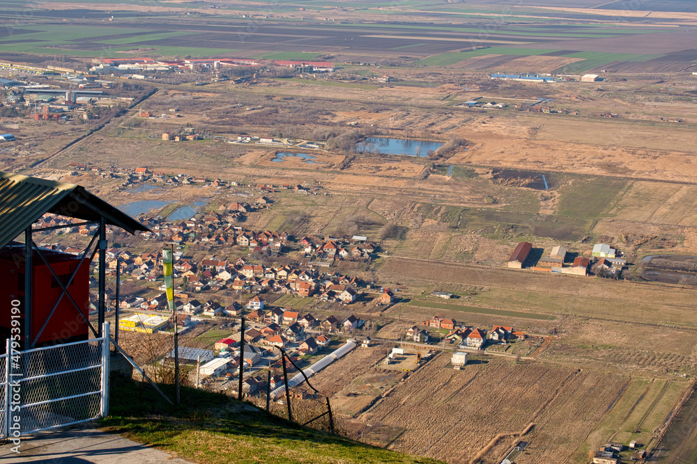 Aerial view of Vrsac town, fields of Vojvodina, Serbia, and Romania from the mountain fortification Vrsac tower (Vršačka Kula)