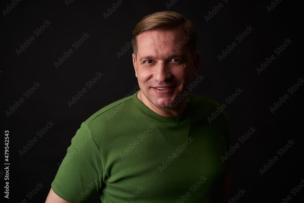 Handsome smiling middle aged man studio portrait