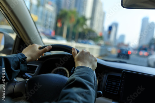 People driving car on city road