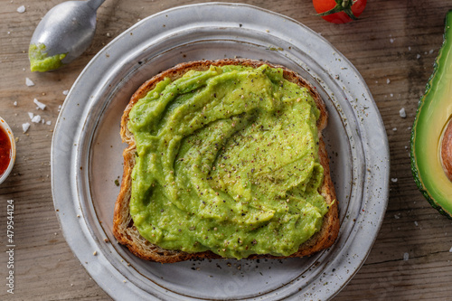 Tasty fresh toast with mashed avocado