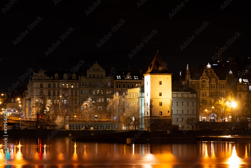 Night Prague, cityscape, reflection of night lights in the Vltava river