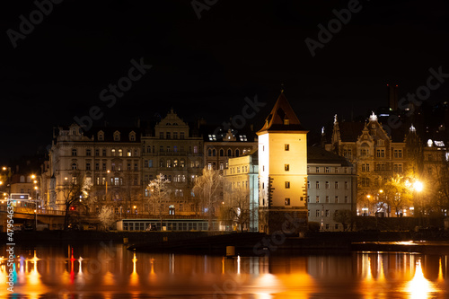 Night Prague, cityscape, reflection of night lights in the Vltava river