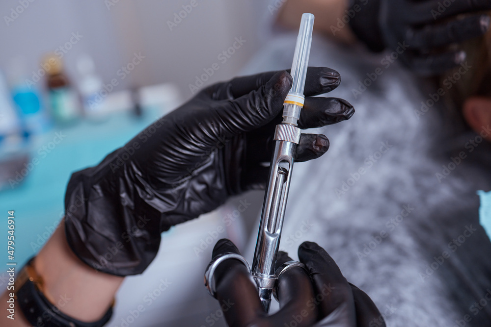 Little girl at dentist office, getting local anesthesia injection into gums. Cropped view of the