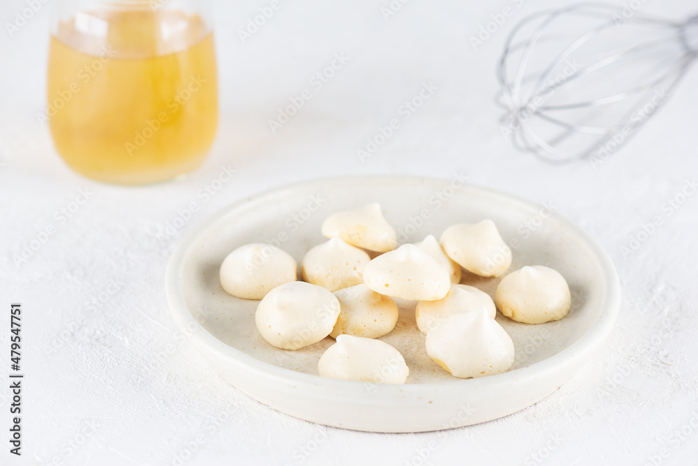 Homemade aquafaba meringue in a plate. Sugar, gluten and lactose free and vegan. Homemade aquafaba meringue in a plate. Sugar, gluten and lactose free and vegan.