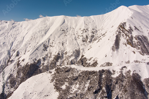 mountains covered with snow, aerial view © Dmitrii