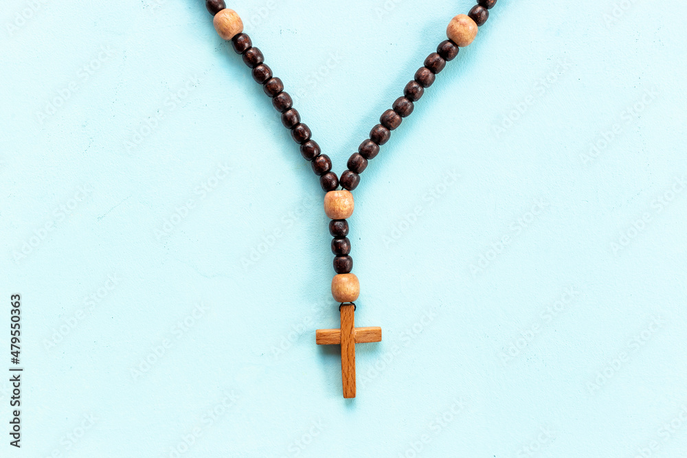 Fototapeta premium Christian rosary beads with wooden cross. Religion concept