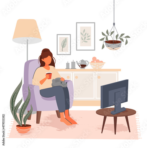 A girl watches TV while sitting on an armchair with a cat and a mug of tea. Vector illustration.