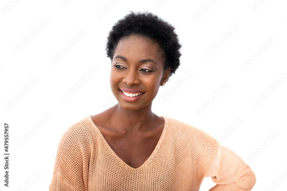 Close up young african American woman smiling and glancing by isolated white backgorund Close up young african American woman smiling and glancing by isolated white backgorund