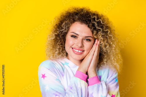 Portrait of attractive cheerful sweet wavy-haired girl in pajama drowsing relaxing isolated over shine yellow color background