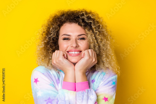 Portrait of attractive cheerful girly wavy-haired girl in pajama relax enjoying isolated over vibrant yellow color background © deagreez