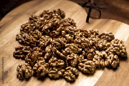 Peeled walnuts. On a wooden board. Healthy food. Natural background.