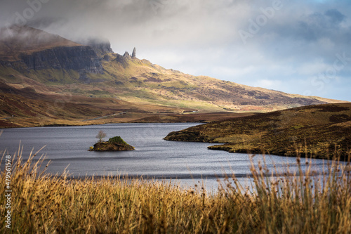 Loch Leathan and Old man of Storr rock formations, Isle of Skye, Scotland. Concept: typical Scottish landscape, tranquility and serenity, particular morphologies. photo