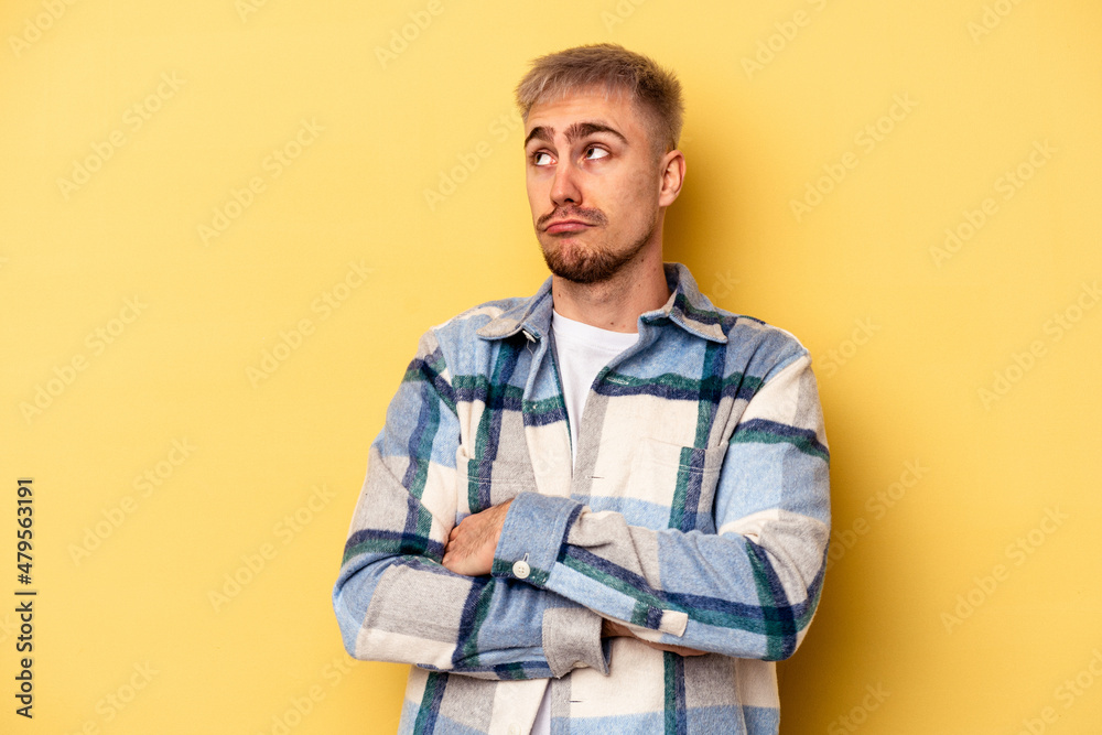 Young caucasian man isolated on yellow background dreaming of achieving goals and purposes Young caucasian man isolated on yellow background dreaming of achieving goals and purposes