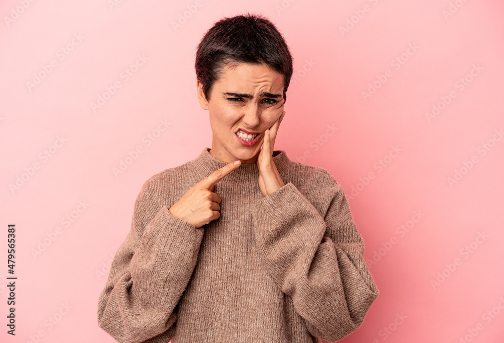 Young caucasian woman isolated on blue background having a strong teeth pain, molar ache. Young caucasian woman isolated on blue background having a strong teeth pain, molar ache.