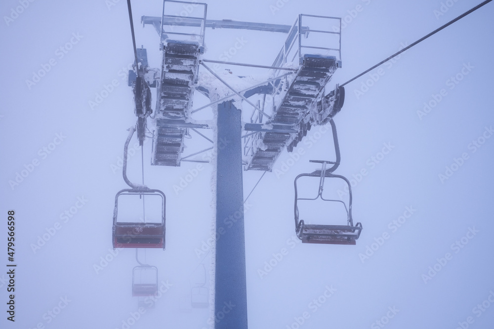chair lift in the mountains. winter active rest in the mountains. lift to the top of the mountain chair lift in the mountains. winter active rest in the mountains. lift to the top of the mountain