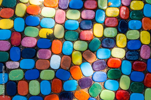 Top view of colorful pattern stone on footpath walkway outdoor in the garden with exterior design concept idea
