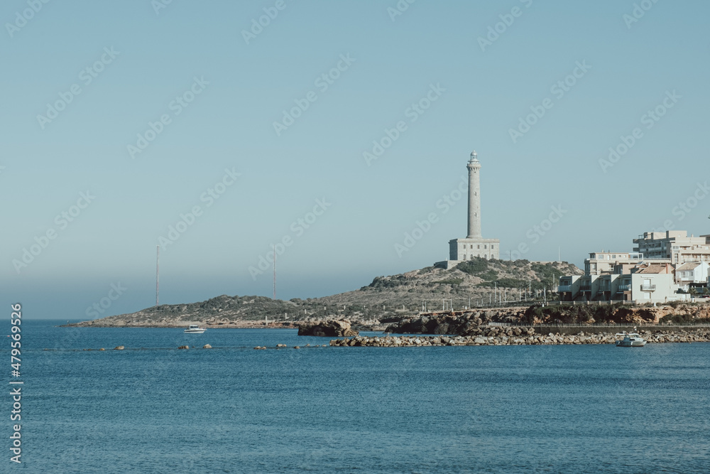 Lighthouse in a coastal town on a cloudy winter day in Cabo de Palos in southern Spain