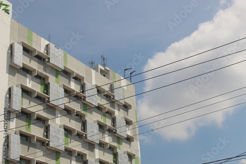 The tall hotel building has a unique architecture seen from the side