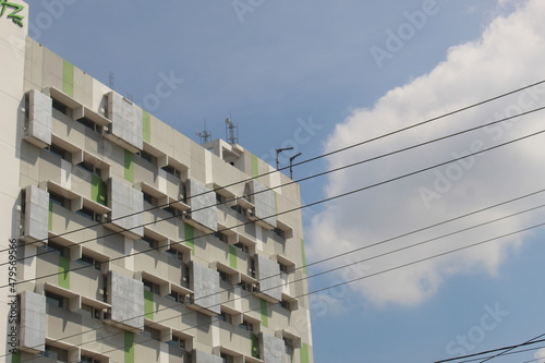 The tall hotel building has a unique architecture seen from the side