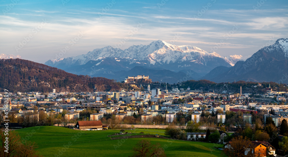 Famous city of Salzburg at sunset, in the background the snow-covered Berchtesgaden Alps, Austria, Europe
