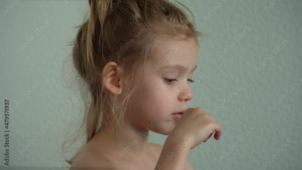 Little girl sucks sweet fruit lollipop. Child eats caramel candy. Chupa Chups. Sweetness