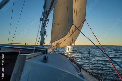 sailing boat at sunset © p.koz