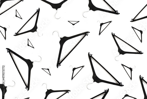 Fototapeta Clothes black Hangers Pattern On A White Background