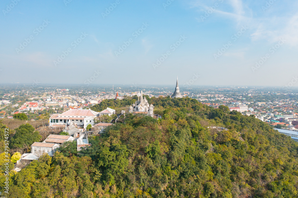 Aerial top view of Phra Nakhon Khiri Historical Park or Khao Wang, Phetchaburi urban city town with forest trees and green mountain hills. Nature landscape background, Thailand.