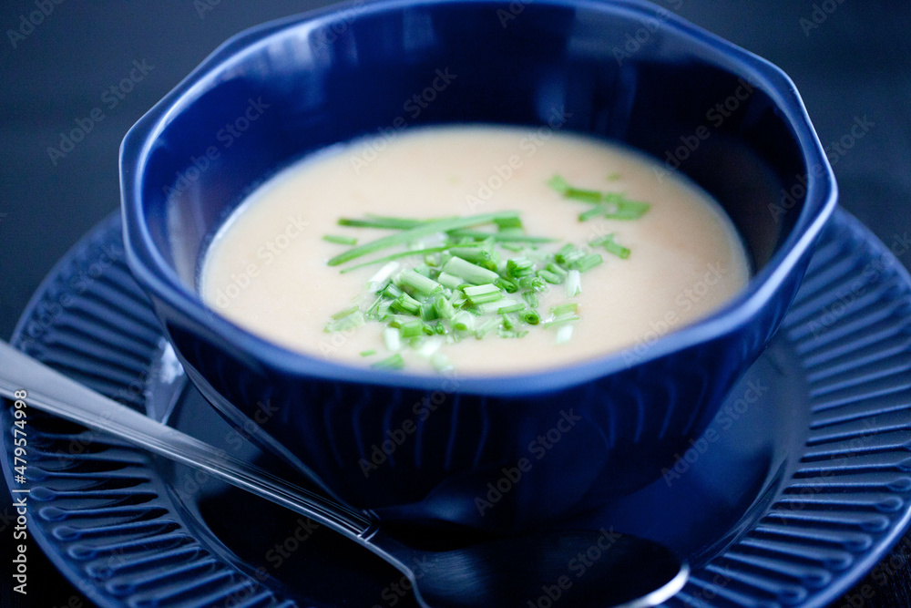 creamy chicken soup puree in a dark blue bowl creamy chicken soup puree in a dark blue bowl
