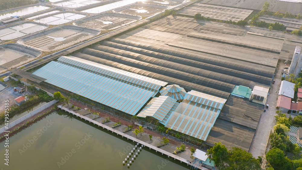 Aerial view of natural sea salt ponds, lake or sea. Farm field outdoor in traditional industry in Thailand. Asia culture. Agriculture irrigation. River reflection. Aerial view of natural sea salt ponds, lake or sea. Farm field outdoor in traditional industry in Thailand. Asia culture. Agriculture irrigation. River reflection.