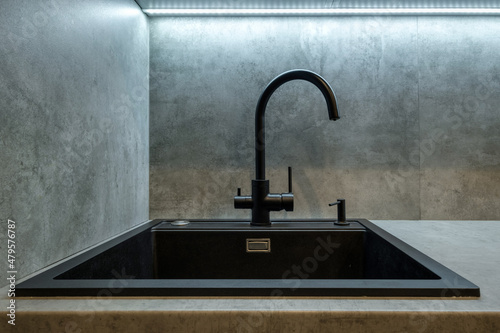 water tap sink with faucet in expensive kitchen