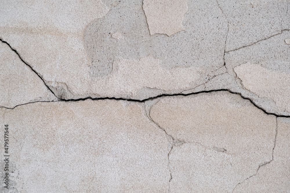 Obraz premium Close up of Cracked concrete wall. Ancient wall with aged plaster. textured background