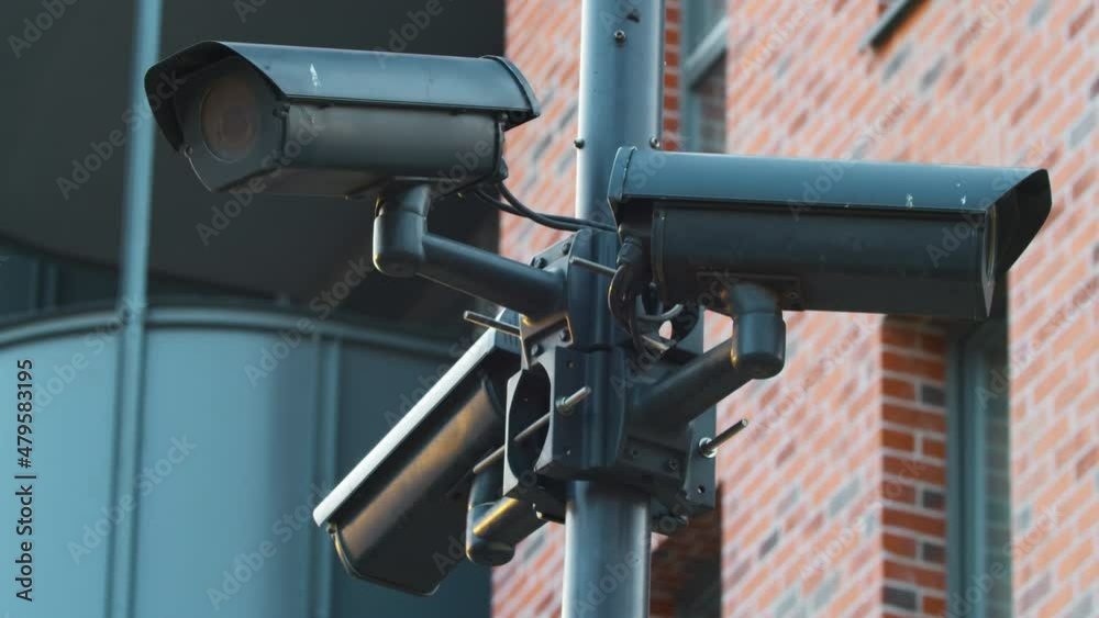 CCTV cameras monitor the street of the city and perform the function of an electronic access system by face ID. A polygonal closed-loop camera of a video surveillance system installed on a city street CCTV cameras monitor the street of the city and perform the function of an electronic access system by face ID. A polygonal closed-loop camera of a video surveillance system installed on a city street