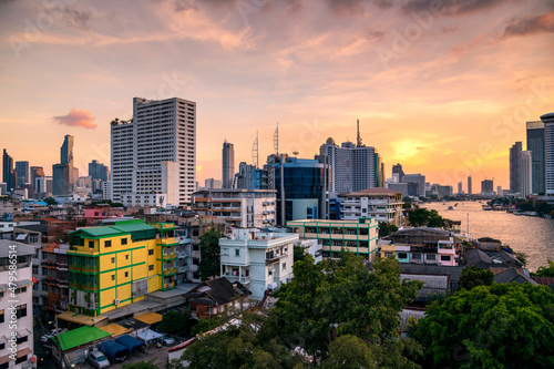 cityscape of Bangkok city skyline with sun rise or sunset sky background, Bangkok city is modern metropolis of Thailand and favorite of tourists
