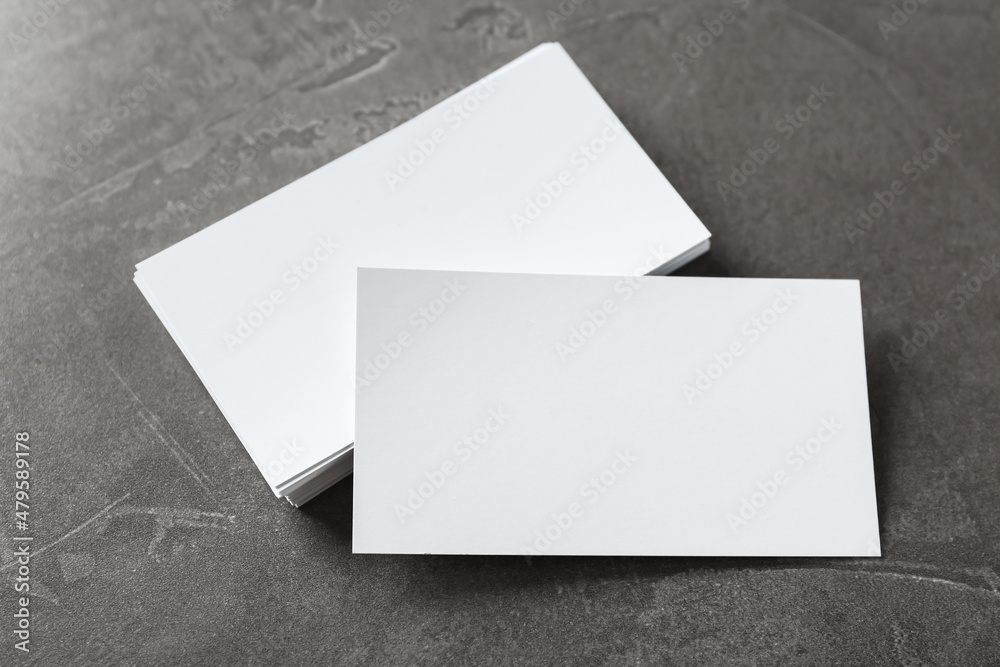 Blank business cards on grey table, above view. Mockup for design Blank business cards on grey table, above view. Mockup for design