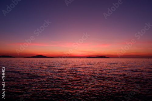 Fototapeta Naklejka Na Ścianę i Meble -  amazing sunset view with sea island and ferryboat