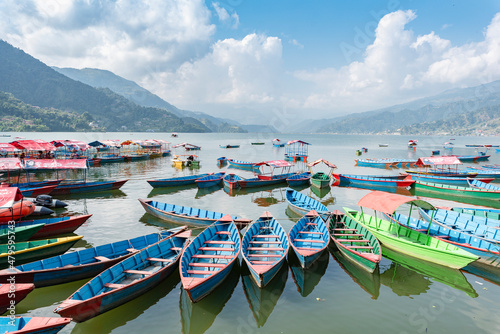 Boats at Phewa Lake in Pokhara, Nepal photo