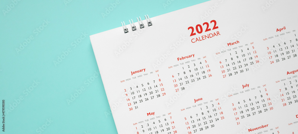 2022 calendar page on blue background business planning appointment meeting concept