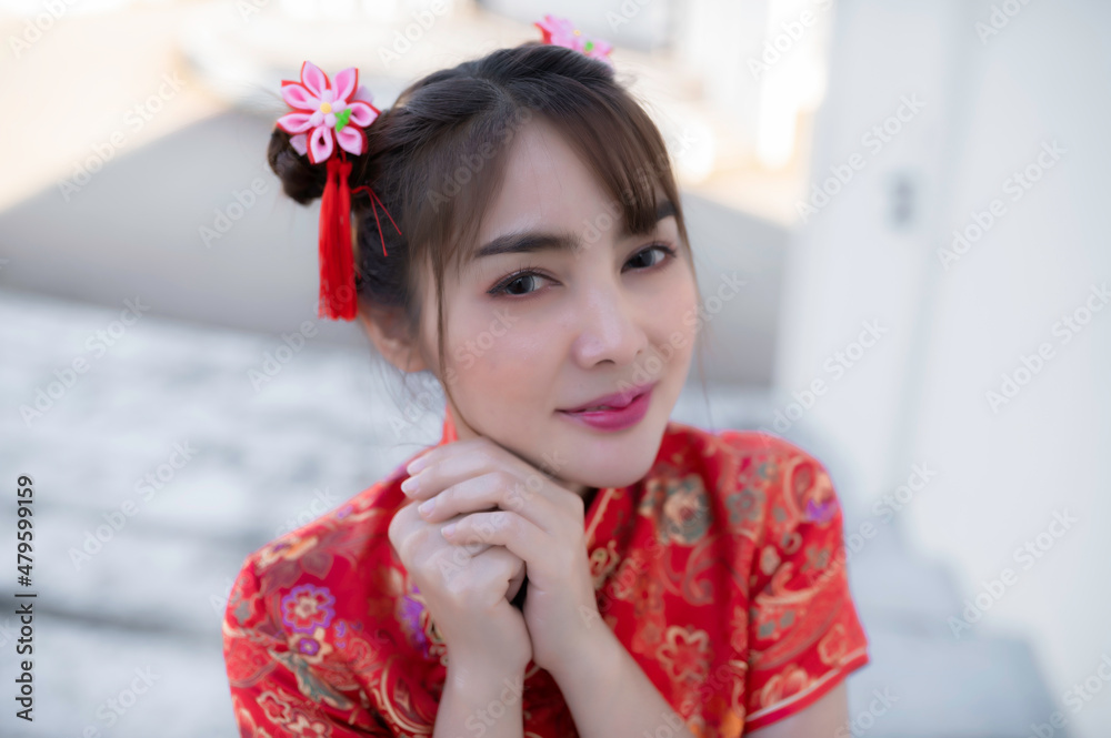 Portrait beautiful asian woman in Cheongsam dress on white background,Thailand people,Happy Chinese new year concept,Happy asian lady in chinese traditional dress Portrait beautiful asian woman in Cheongsam dress on white background,Thailand people,Happy Chinese new year concept,Happy asian lady in chinese traditional dress