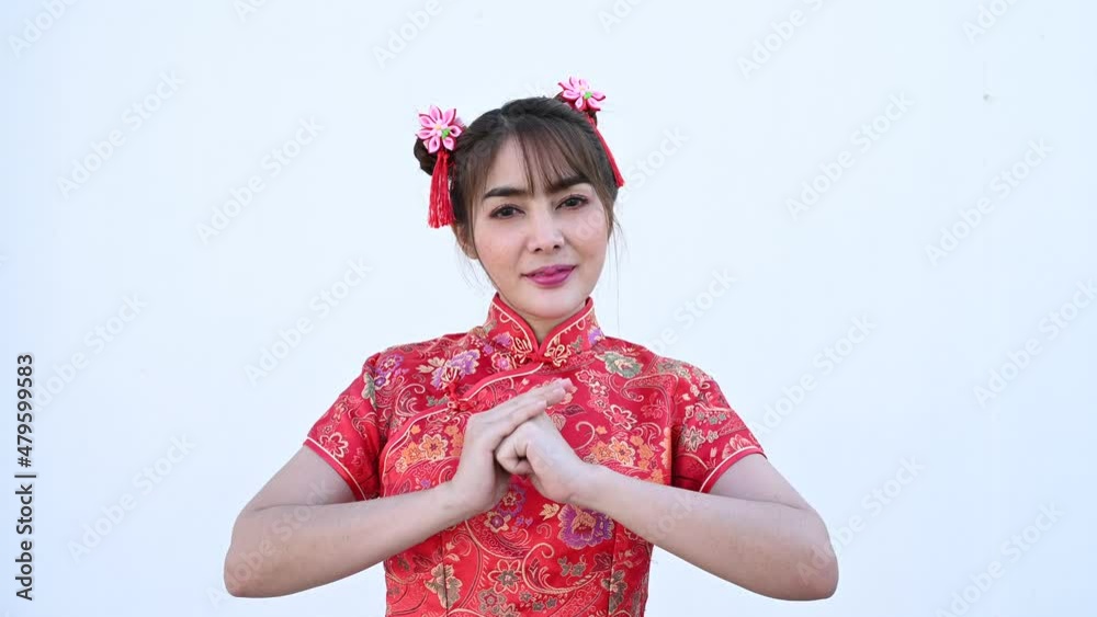 Portrait beautiful asian woman in Cheongsam dress on white background,Thailand people,Happy Chinese new year concept,Happy asian lady in chinese traditional dress Portrait beautiful asian woman in Cheongsam dress on white background,Thailand people,Happy Chinese new year concept,Happy asian lady in chinese traditional dress