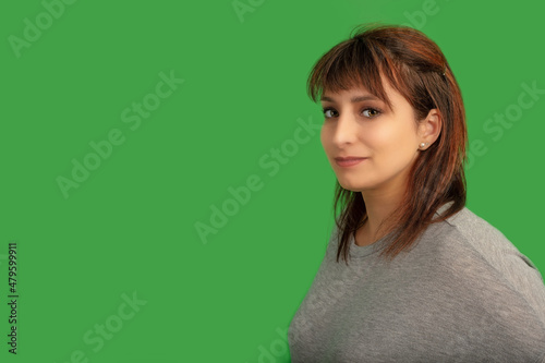 redhead woman on green screen lady in her thirties on chromakey background