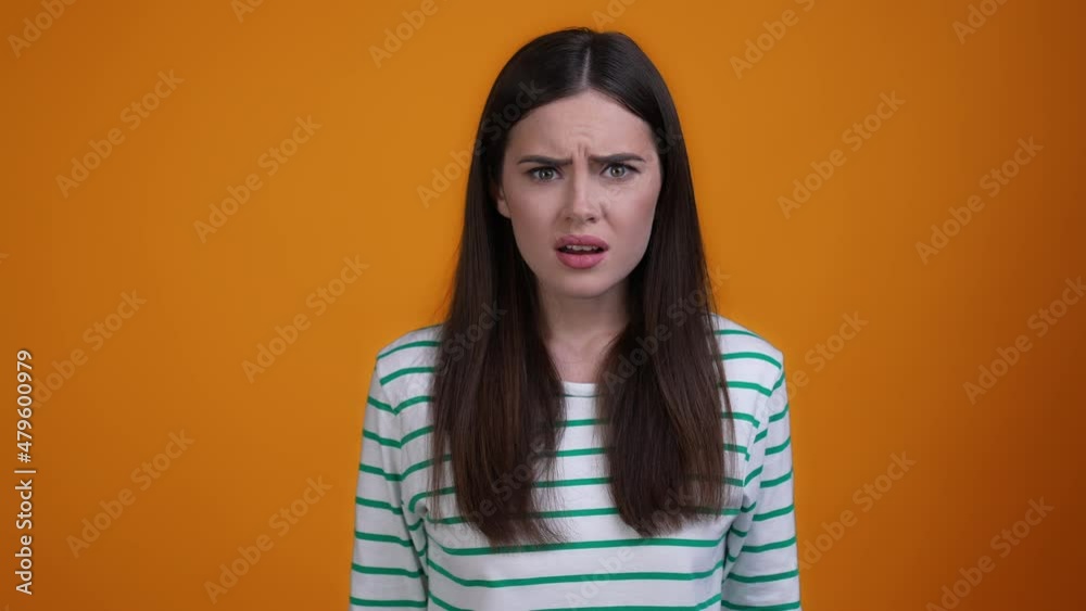 Frustrated lady open mouth horrible message isolated mustard color background Frustrated lady open mouth horrible message isolated mustard color background
